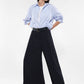 Pantaloni a palazzo monocolour con piega stirata e cintura IMPERIAL.